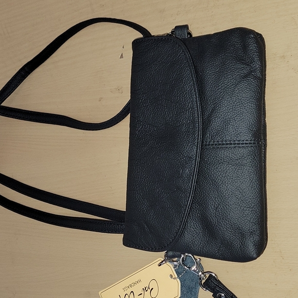 Black cowhide leathder crossbody purse. Very soft and lots of pockets. - Picture 4 of 12